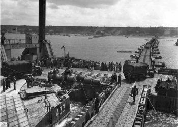 A Whale floating roadway leading to a Spud pier at Mulberry A off Omaha Beach