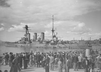 THE BRITISH NAVY BRINGS FOOD TO GREECE. 20 AND 21 OCTOBER 1944, PIRAEUS HARBOUR, ATHENS. BRITISH MERCHANTMEN ESCORTED BY SHIPS OF THE BRITISH AND GREEK NAVIES, BROUGHT THE FIRST FOOD SUPPLIES FOR THE RELIEF OF GREECE. (A 26352) Greek citizens watching their country's veteran heavy cruiser GEORGE AVEROFF after her arrival at Piraeus. Copyright: � IWM. Original Source: http://www.iwm.org.uk/collections/item/object/205157963