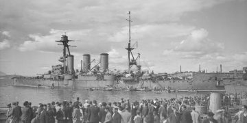 THE BRITISH NAVY BRINGS FOOD TO GREECE. 20 AND 21 OCTOBER 1944, PIRAEUS HARBOUR, ATHENS. BRITISH MERCHANTMEN ESCORTED BY SHIPS OF THE BRITISH AND GREEK NAVIES, BROUGHT THE FIRST FOOD SUPPLIES FOR THE RELIEF OF GREECE. (A 26352) Greek citizens watching their country's veteran heavy cruiser GEORGE AVEROFF after her arrival at Piraeus. Copyright: � IWM. Original Source: http://www.iwm.org.uk/collections/item/object/205157963